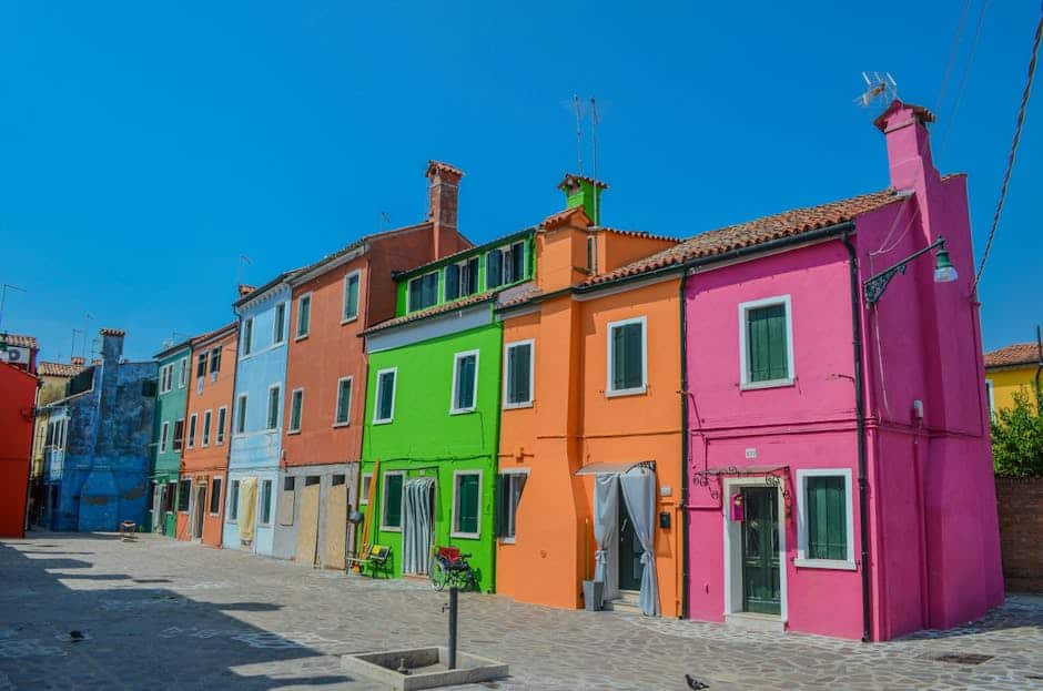 Brightly colored houses on Burano Island, Venice, showcasing Italian architectural charm.