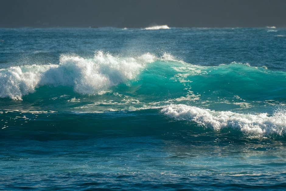 Vibrant ocean waves crash dynamically in Puerto de la Cruz, Canary Islands, Spain.